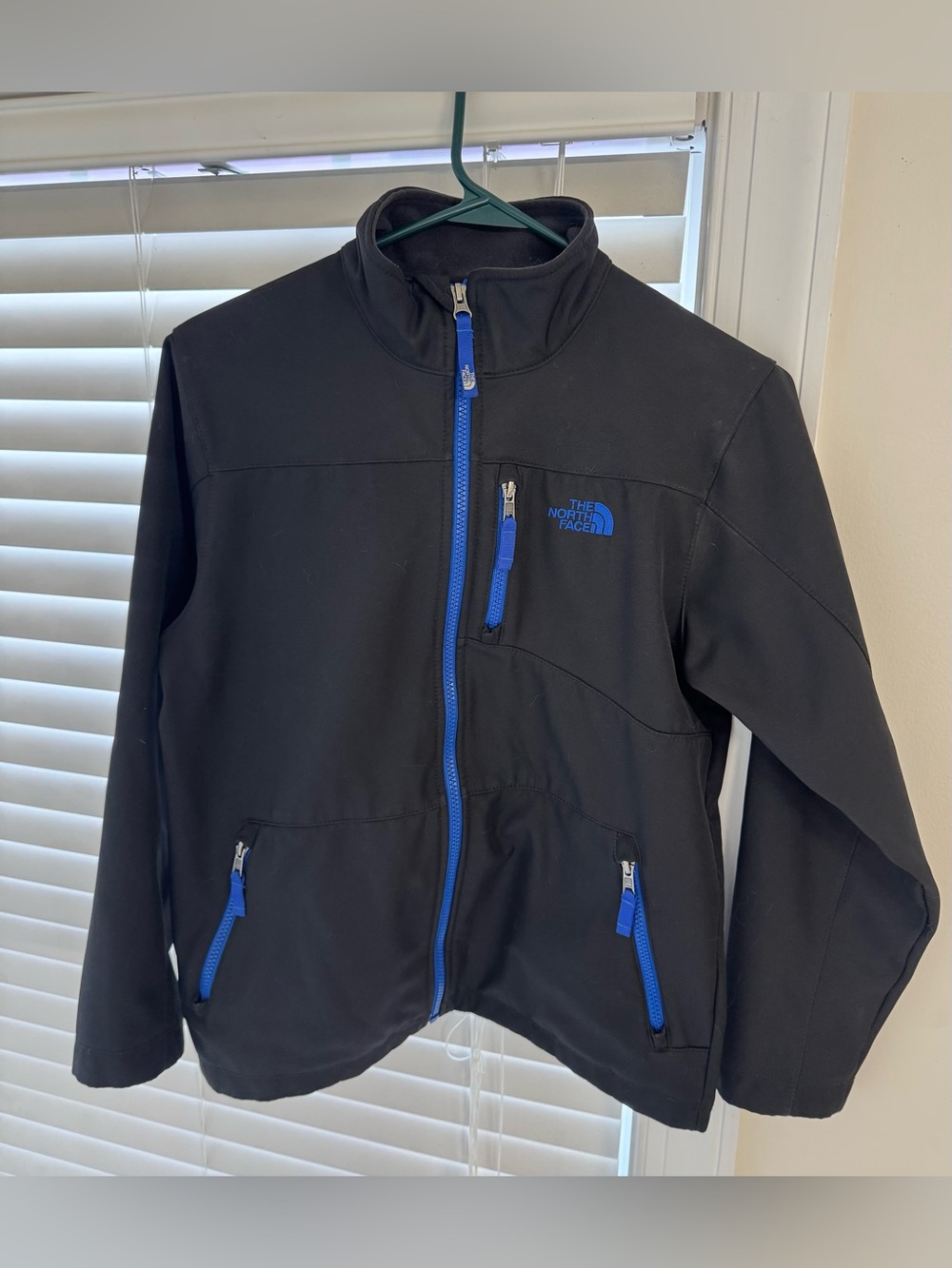 The North Face Black Kids Softshell Jacket with Blue Zippers